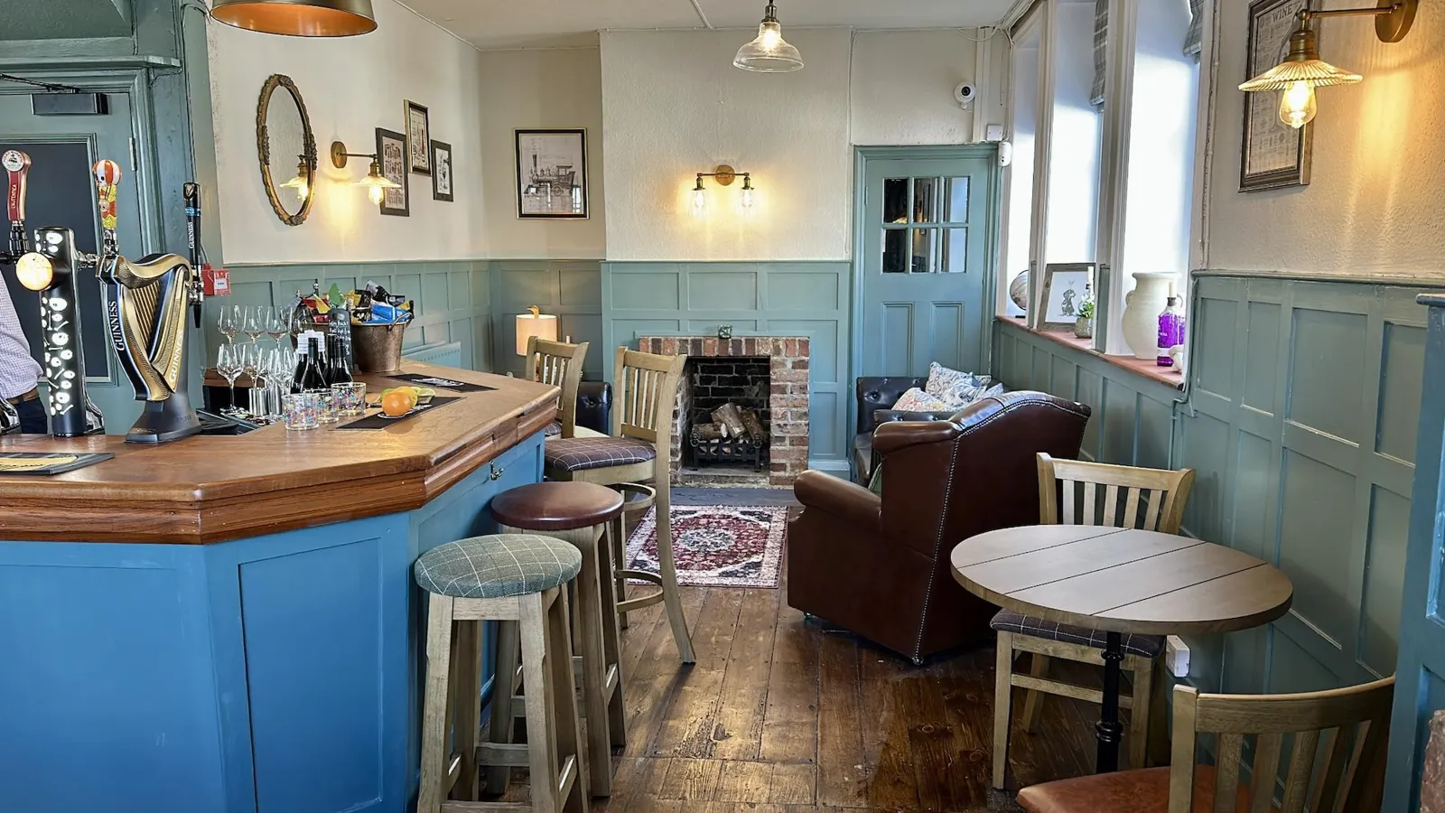 The bar and fireplace at The Railway Inn, Billingshurst